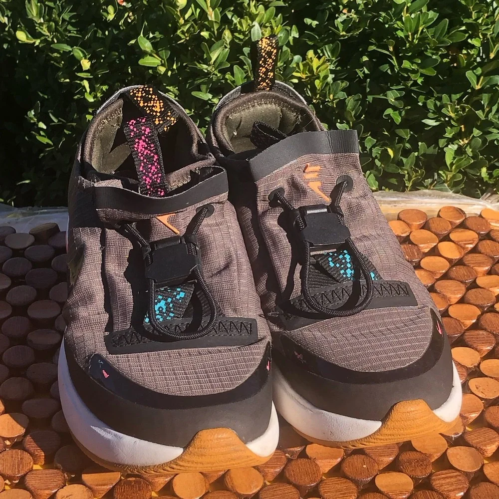 Nike Kids Gray Slip-On Sneakers with Pink Heel Accent